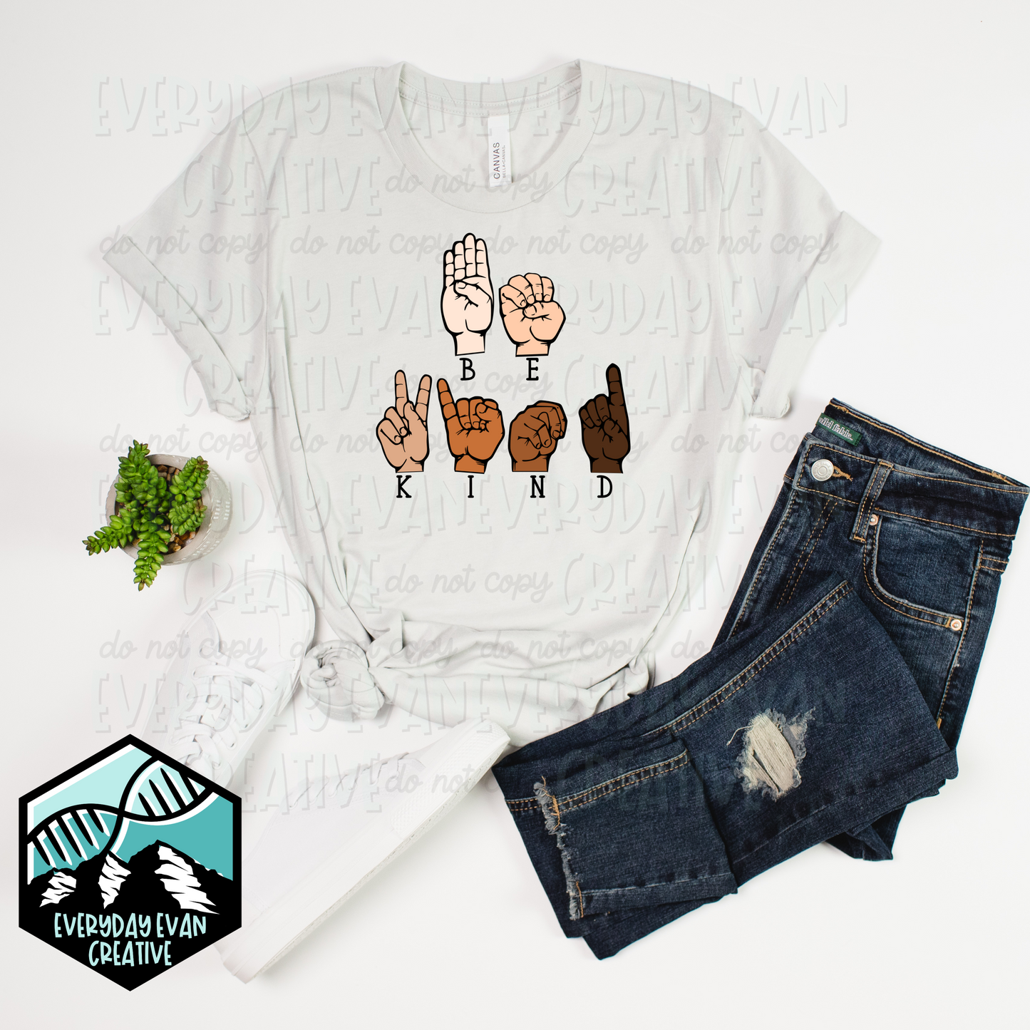 A shirt that reads Be Kind in ASL 