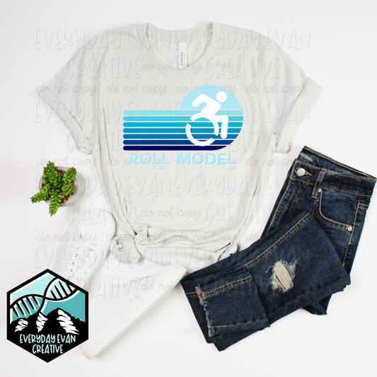 A shirt that reads roll model with a wheelchair image